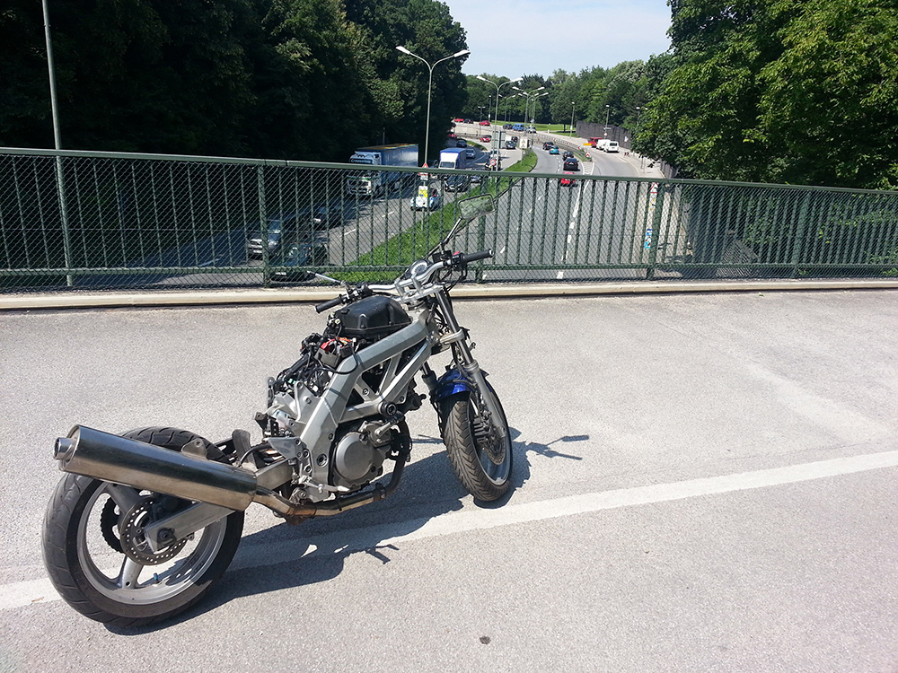 Stripped SV650 on bridge
